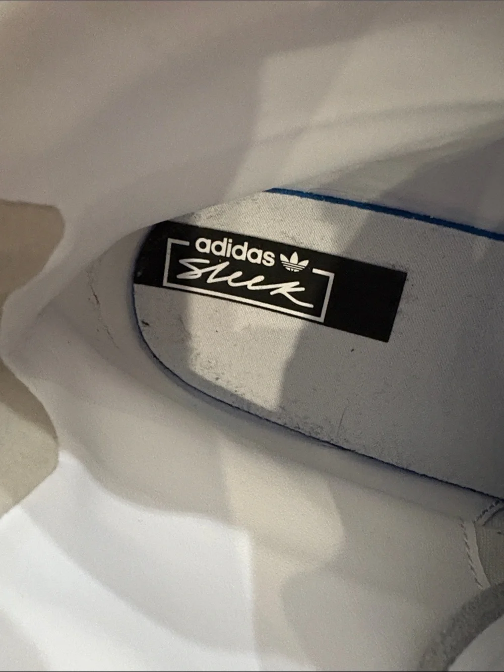 adidas White High-Top Sneakers with Gold Accents
